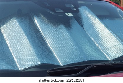 Collapsed Sun Shade Or Sun Reflector On The Windshield The Car