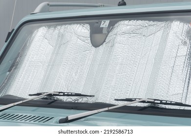 Collapsed Sun Shade Or Sun Reflector On The Windshield The Car