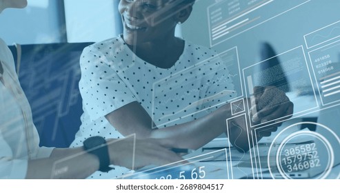 Colleagues in blouses analyzing printed documents and charts in meeting room, with coffee and phone. Collaboration, dataanalysis, professionalism, moderndesign, teamwork, corporate, businesswomen