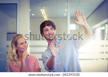 Colleagues envisioning an idea together in creative office