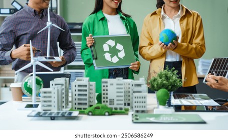 Colleagues in formal suits meet at desk to brainstorm environmental management strategies. discuss carbon emissions, renewable energy, sustainable business practices to reduce corporate footprint. - Powered by Shutterstock