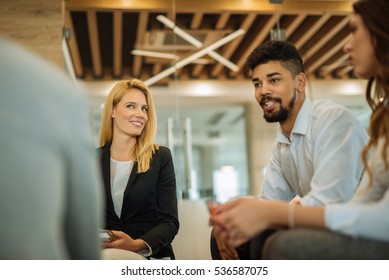 Colleagues Having A Meeting In A Conference Room.