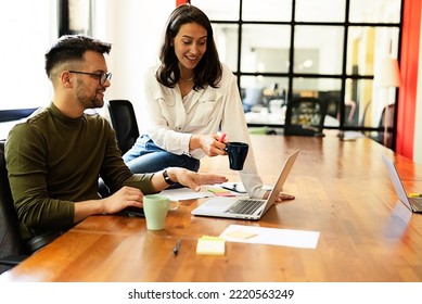 Colleagues in office. Businesswoman and businessman drinking coffee - Shutterstock ID 2220563249
