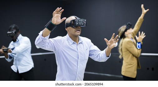 Colleagues Playing Video Games Using Virtual Reality Glasses During Team Building