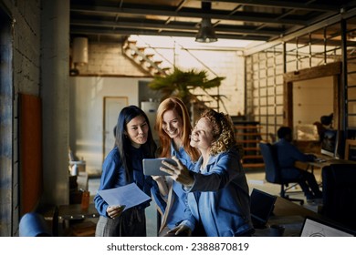 Colleagues Sharing a Joyful Moment with a Selfie at the Office - Powered by Shutterstock