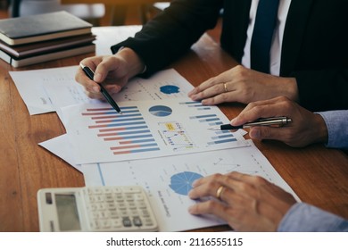 Colleagues are stress talking about the finance results report and compared with the financial information on the paperwork with analysis about planning in the future. - Shutterstock ID 2116555115