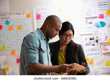 Colleagues using digital tablet