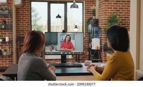 Colleagues Using Video Call Conference To Recruit Woman At Online Job Interview. Workmates Attending Remote Videoconference Meeting On Computer To Hire Intern With Work Contract.