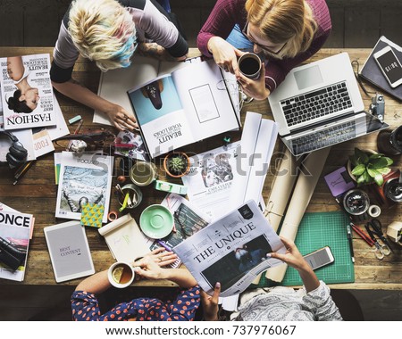 Colleagues working at a desk 