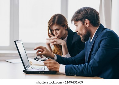   Colleagues working with laptop business.                              - Shutterstock ID 1149431909