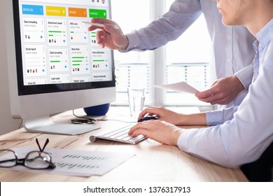 Colleagues working on agile product development board with scrum or kanban framework, lean methodology, iterative or incremental organization project management strategy for startup or software design - Shutterstock ID 1376317913