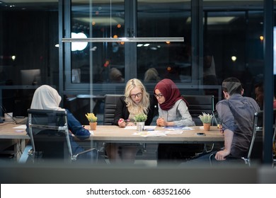 Colleagues Working Overtime In Their Office. Working A Night Shift In The Office. 