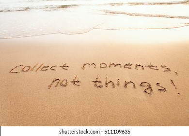 collect moments, not things - happiness concept, happy lifestyle inspirational quote, enjoy the life, text on sand - Shutterstock ID 511109635