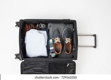 To collect things into a large black suitcase on a trip. An empty space to insert text.