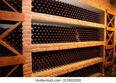 Collectible Wine Bottles In The Basement On The Shelf