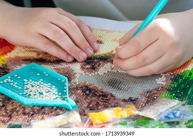 Collecting diamond embroidery, diamond mosaic. Colored crystals.