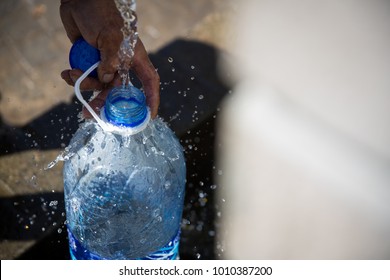 Collecting Natural Spring Water With 5 Litre Plastic Water Bottle At Newlands Natural Spring Cape Town South Africa 