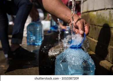 Collecting Natural Spring Water With 5 Litre Plastic Water Bottle At Newlands Natural Spring Cape Town South Africa 