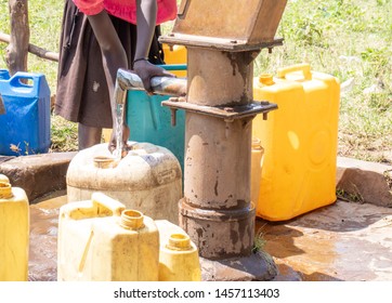 Collecting Water In Jerry Cans Borehole Uganda