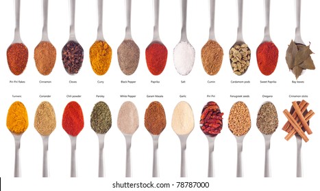 collection of 22 spices on spoons (cumin, coriander, curry, paprika, chili, piri piri, cinnamon, fenugreek, cardamom, oregano, parsley, garlic, salt, cloves, garam masala, bay) isolated on white - Powered by Shutterstock