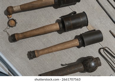 Collection of antique objects, including binoculars brass, leather, compass, lantern, keys, arranged on a wooden surface Earthy color palette with soft shadows from naturalistic lighting No texts