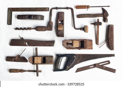 Collection of antique woodworking tools, isolated on white