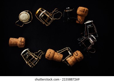 A Collection Of Assorted Champagne Cages And Corks Arranged In A Circle, Oval With Copy Space In The Center