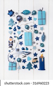 Collection Of Blue And Turquoise Miniatures With Presents For Christmas Decoration On Wooden White Background.