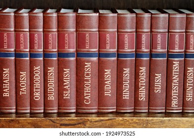 Collection Of Books Arranged In A Row Of Various Religions Bound In Brown Leather On A Wooden Shelf