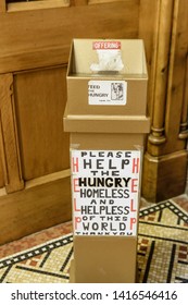 Collection Box In A Church Asking For Donations For The Hungry, Homeless And Helpless Of This World.