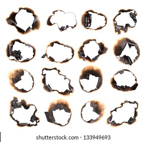 Collection burnt holes in piece paper isolated white background