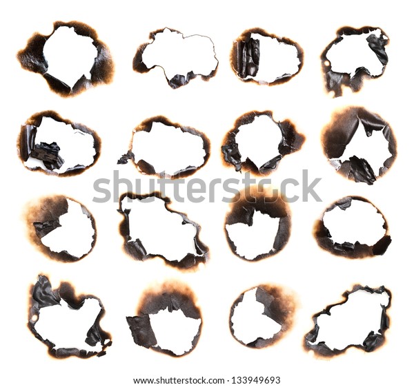 Collection of burnt holes in a piece of paper\
isolated on white\
background
