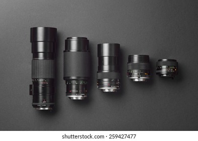 Collection of camera lens well organized over black background - Powered by Shutterstock