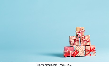 Collection of Christmas present boxes on a light blue background