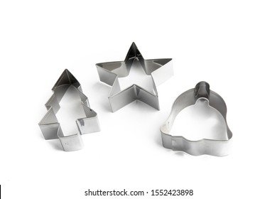 A Collection Of Christmas Themed Cookie Cutters Isolated On White