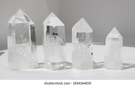 Collection Of Clear Quartz Crystal On Plain Background 