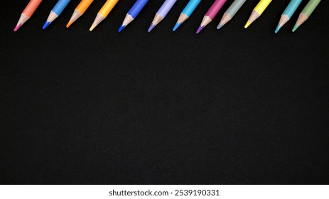 A collection of colored pencils arranged neatly on a black surface ready for creative projects or classroom activities
 - Powered by Shutterstock