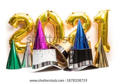 A collection of colorful New Year's Eve party hats with 2021 gold lettering in the background Stock photo © 