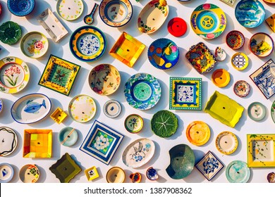 Collection of colorful Portuguese ceramic pottery, local craft products from Portugal. Ceramic plates display in Portugal. Colorful of vintage ceramic plates in Sagres, Portugal. - Shutterstock ID 1387908362