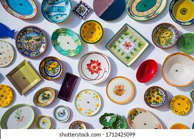 Collection of colorful Portuguese ceramic pottery, local craft products from Portugal. Ceramic plates display in Portugal. Colorful of vintage ceramic plates in Sagres, Portugal. - Powered by Shutterstock