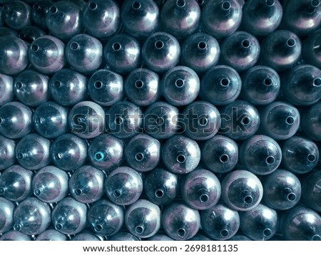 Collection of Conical Objects, This image showcases a multitude of conical objects arranged closely together.