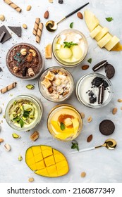 collection of delicious ice cream served in a glass jar, italian dessert gelato pistachio, chocolate, caramel, melon, mango, chocolate chip sandwich cookies, vertical image. top view,