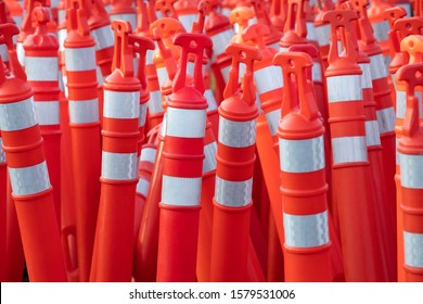 Collection of delineator posts in an orange construction scene - Shutterstock ID 1579531006
