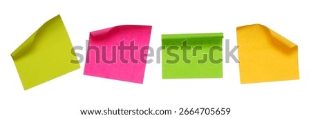 Collection of different colored sheets of note papers with curled corner, isolated on white background, clipping path