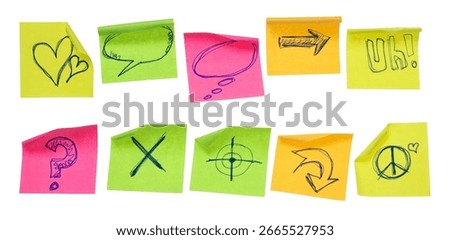Collection of different colored sheets of note papers, curled corner with drawn symbols, isolated on white background, clipping path