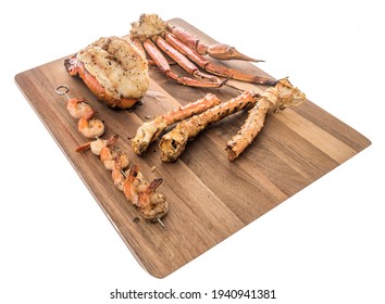 A Collection Of Different Kinds Of Seafood With Lobster Tail That Is Saddleback, Tiger Shrimp, Shrimp On Skewers, Alaskan Snow Crab And Alaskan King Crab