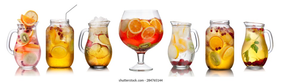 Collection of different summer party drinks in bulk glasses. Pitchers,jugs and jars filled with sangria,spritzers,detox and infused waters.