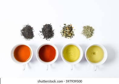 Collection Of Different Teas In Cups With Tea Leaves On A White Background.