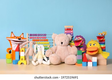 Collection of different toys on wooden table - Powered by Shutterstock