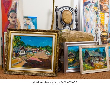 Collection of different types of handmade framed paintings in the workshop.